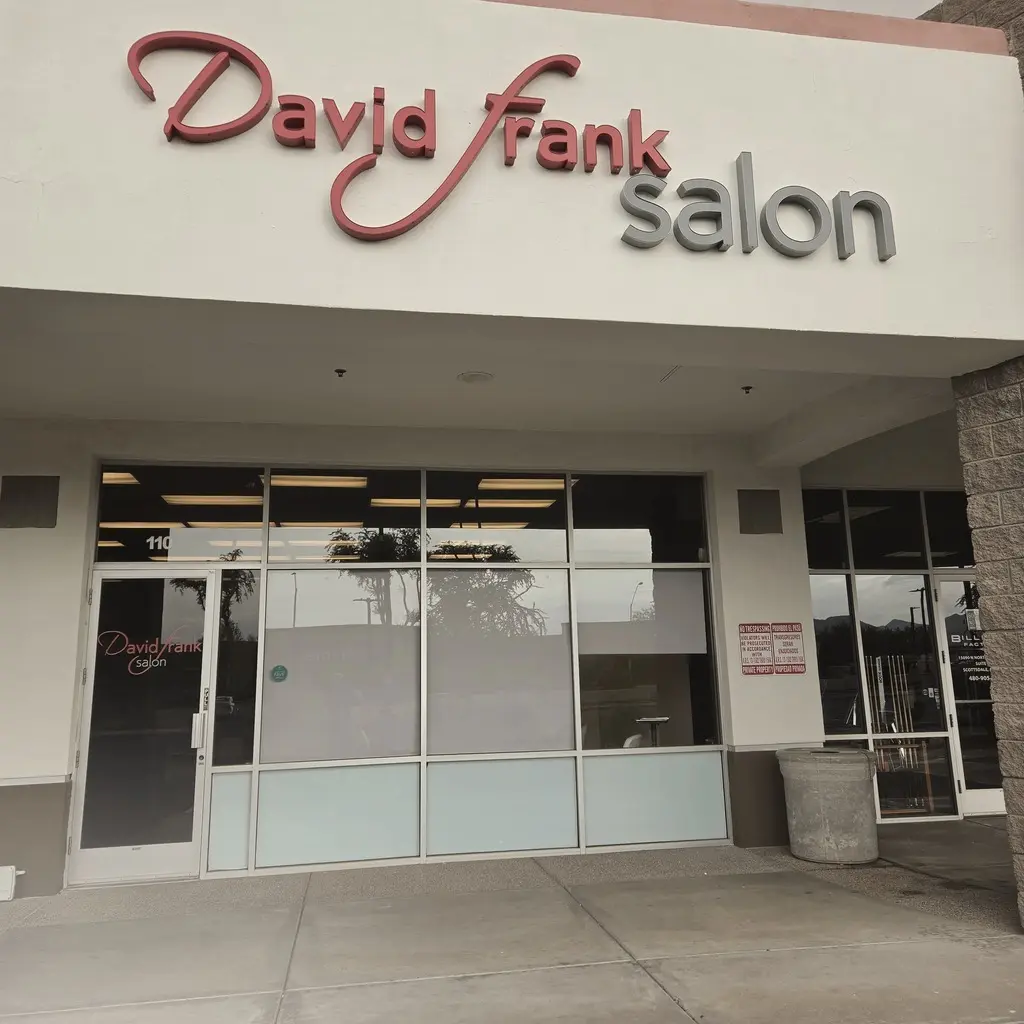 David Frank Salon storefront with its red and grey sign above glass doors
